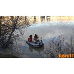 Survey crew carrying out measurements from a small boat