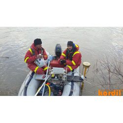 Survey crew carrying out measurements from a small boat