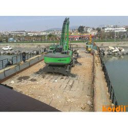 Excavator or dredging equipment at the work site