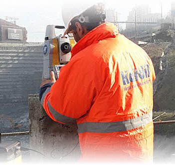 Surveyor and geodetic instrument during field measurements