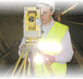 Surveyor and geodetic instrument during field measurements