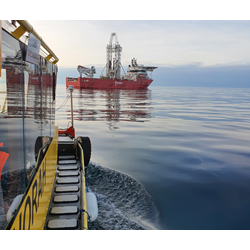 Survey vessel or workboat at a marine project site