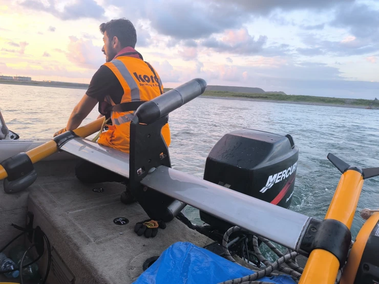Kordil surveyor with a paired-sensor marine gradiometer aboard a survey boat