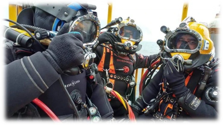 Commercial diving team equipped for underwater inspection and target verification.