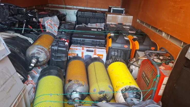 Survey mobilisation: marine sensor housings and equipment cases secured for transport.