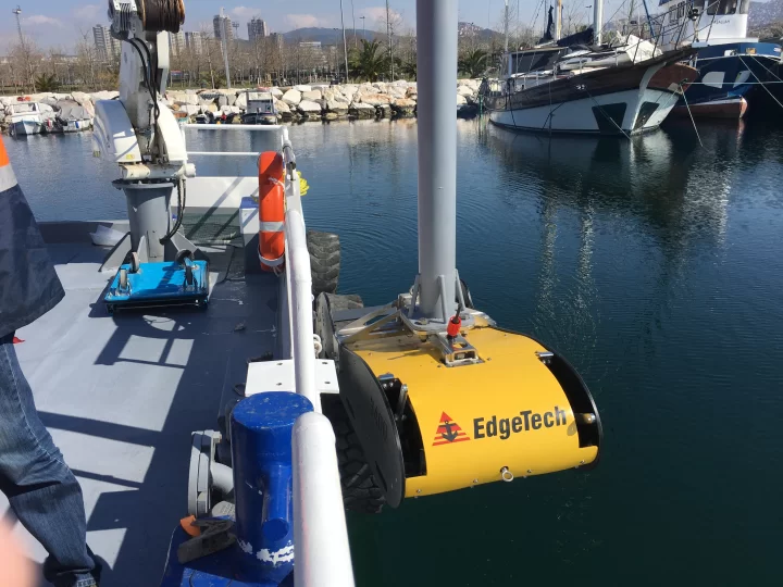 EdgeTech sub-bottom profiler mounted on a pole alongside a Kordil survey vessel