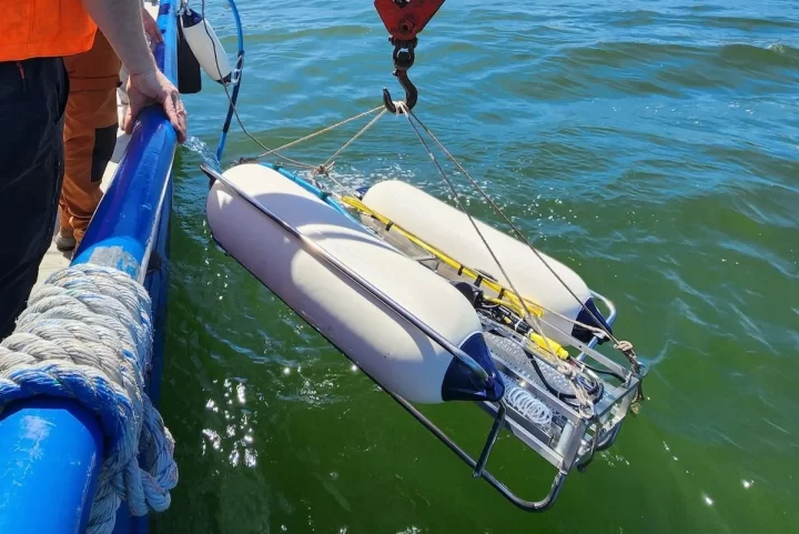 Applied Acoustics sparker being deployed beside a survey vessel